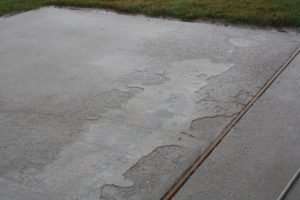 The uneven surface of this concrete is called spalling, caused by freeze and thaw of water after using ice melt.